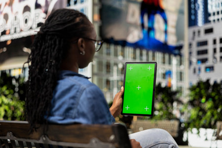 Green screen device used by freelance artist outside using tactile touchscreen to draw, finishing...