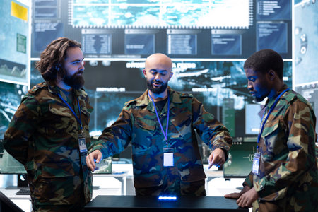 Military specialist presenting officers intel on enemy movement using holographic battlefield projection in command center. Intelligence analyst showing soldiers augmented reality projection
