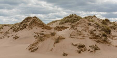 Sandy dunes at Balmedie beach on a cloudy day, Aberdeenshireの写真素材