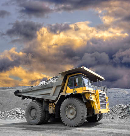 Heavy mining truck driving through the iron ore opencastの写真素材