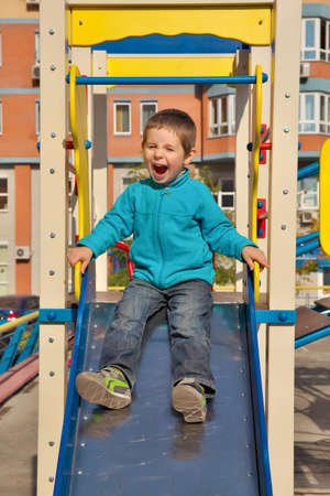 Little boy having fun on the playgroundの写真素材