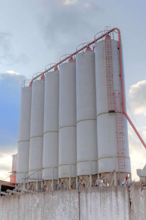 Cement factory site - group of storage silosの写真素材