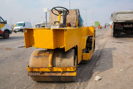 Road works: pavement roller on the side of the road