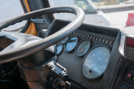 Truck cabin interior close up view - steering wheel and dashboardの写真素材