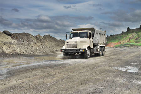 Poltava Region, Ukraine - June 26, 2010: white dump truck on the iron ore opencastのeditorial素材