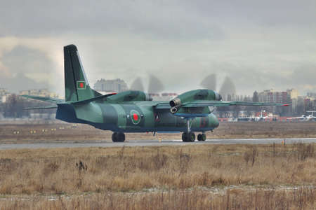 Kiev, Ukraine - December 24, 2011: Bangladesh Air Force cargo plane An-32 is taking off from the runwayのeditorial素材