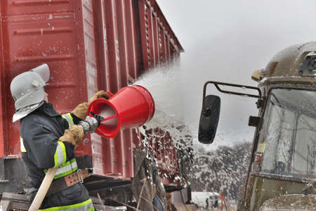 Nezhin, Ukraine - January 14, 2011: Fireman at work during the trainingのeditorial素材