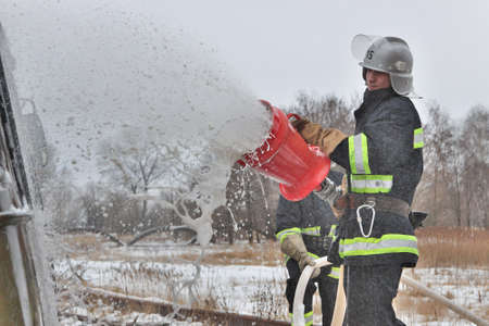 Nezhin, Ukraine - January 14, 2011: Firemen at work during the fire fighting trainingのeditorial素材