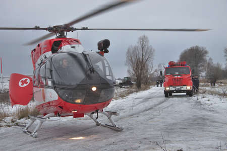 Nezhin, Ukraine - January 14, 2011: Ukrainian Ministry of Emergency Situations Eurocopter EC145 (BK-117) rescue helicopter landed in the fieldのeditorial素材