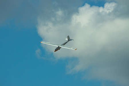 Gostomel, Ukraine - October 3, 2010: Let L-13 Blanik flying in a cloudy skyのeditorial素材