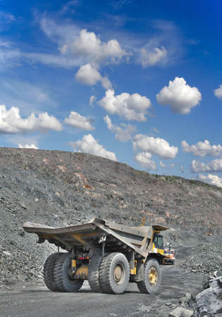 Heavy dump truck on the iron ore opencast ready for being loadedの写真素材