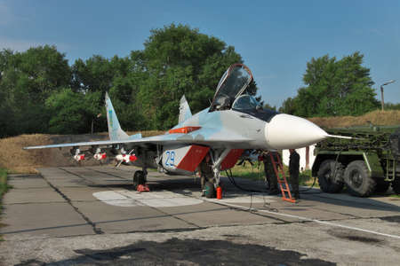 Vasilkov, Ukraine - August 3, 2012: Ukrainian Air Force MiG-29 being prepared for a training flightのeditorial素材