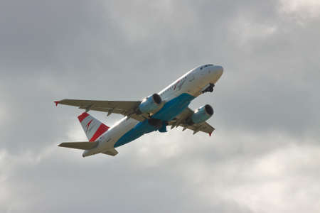 Borispol, Ukraine - October 2, 2010: Austrian Airlines Airbus A319 passenger plane is taking off into the cloudy skyのeditorial素材