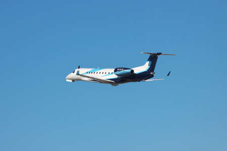 Simferopol, Ukraine - September 12, 2010: Embraer EMB-135BJ business jet is taking off from the airport into the blue skyのeditorial素材