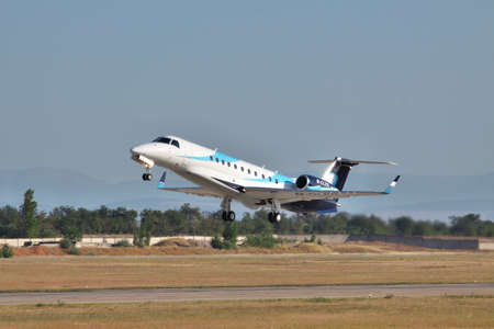 Simferopol, Ukraine - September 12, 2010: Embraer EMB-135BJ business jet is taking off from the runway in the airportのeditorial素材