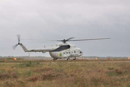 Zhitomir, Ukraine - September 29, 2010: Ukrainian Army military transport helicopter landed on the field in heavy storm during the military trainingsのeditorial素材