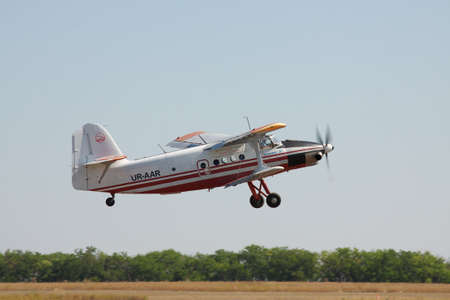 Odessa, Ukraine - August 27, 2011: Antonov An-3 turboprop biplane is taking off from the airfieldのeditorial素材