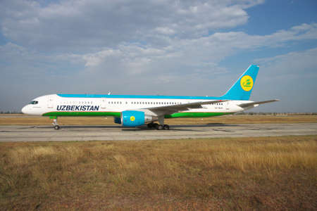 Simferopol, Ukraine - September 13, 2010: Uzbekistan Airways Bowing 757-200 is taxiing along the taxiway in the airportのeditorial素材