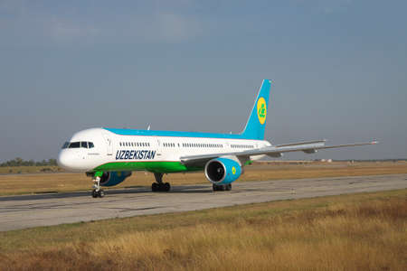 Simferopol, Ukraine - September 13, 2010: Uzbekistan Airways Bowing 757-200 is taxiing along the taxiway in the airportのeditorial素材