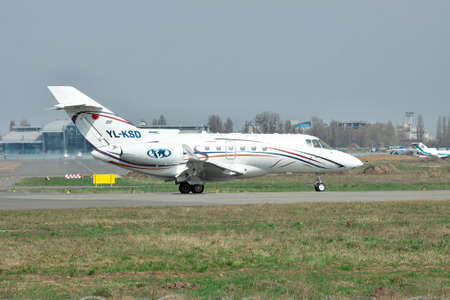 Kiev, Ukraine - April 14, 2012: Hawker 850XP business jet is preparing for takeoff on runwayのeditorial素材