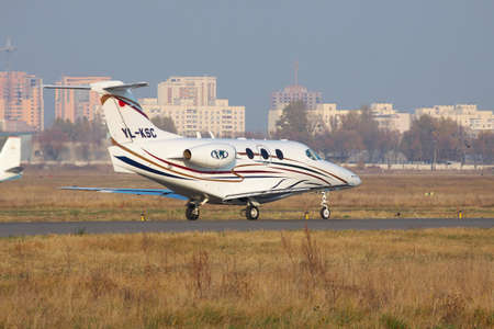 Kiev, Ukraine - November 5, 2011: Raytheon 390 Premier business jet is taking off from the airportのeditorial素材