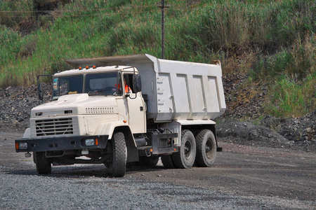 Poltava Region, Ukraine - June 26, 2010: Dump truck is turning around on the opencast mining siteのeditorial素材