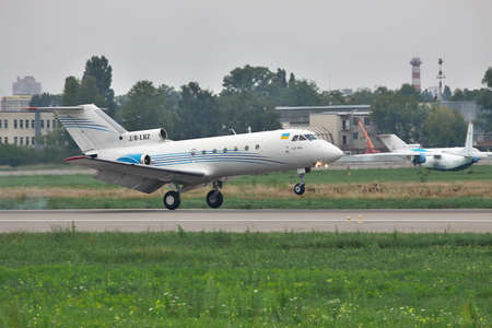 Kiev, Ukraine - July 27, 2011: Yakovlev Yak-40 regional passenger jet plane is landing on the runway in the airportのeditorial素材
