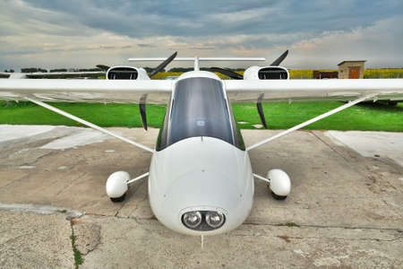 Kiev Region, Ukraine - July 19, 2014: Light private twin-engine plane parked on an airfield with...