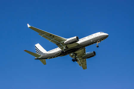 Kiev Region, Ukraine - June 9, 2011: Tu-204-300A passenger plane is landing with the blue clear sky...