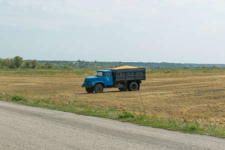 Old truck carrying soybeans in the fields