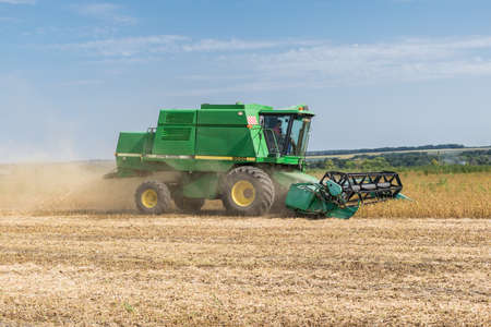 Kiev Region, Ukraine - September 10, 2017: John Deere 9500 Harvester is harvesting the soybean field on a summer autumn dayのeditorial素材