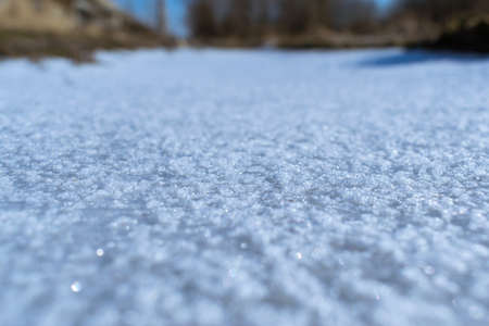 Fresh ice on the river covered with some snowの写真素材