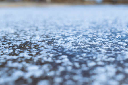 Fresh ice on the river covered with some snowの写真素材