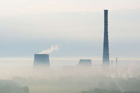 Heat power plant in the morning mistの写真素材