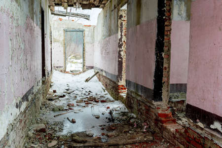 Abandoned building ruins and interior with cracked walls