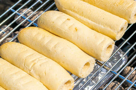 Hot dog buns almost ready to be served on the grillの写真素材