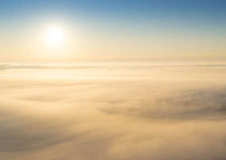 Sunrise in fog over the valleyの写真素材