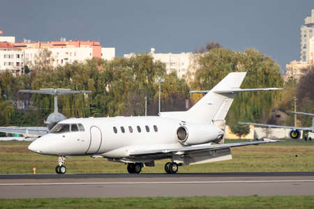 Business jet with reverse scoops released on runway