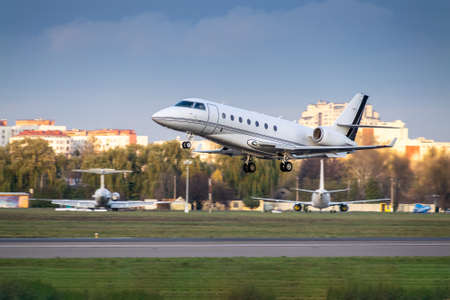 Busines jet is taking off from runway in the airportの写真素材