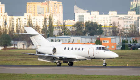 Business jet with reverse scoops released after landing on runwayの写真素材