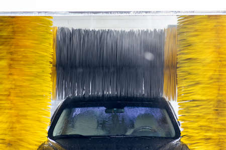Car is being washed in an automatic tunnel wash for carsの写真素材