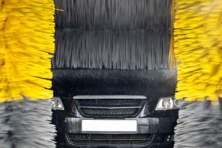 Car is being washed in an automatic tunnel car wash closeupの写真素材
