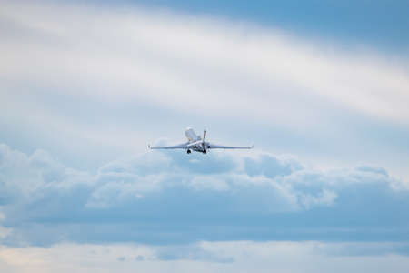 Business jet is taking off from with clouds on the backgroundの写真素材