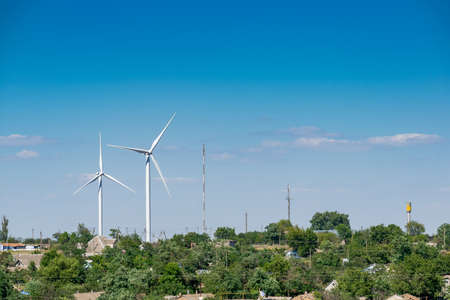 Wind turbines on the hill in the rural area landscapeの写真素材