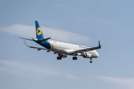 Boryspil, Ukraine - September 25, 2020: Ukraine International Airlines Embraer ERJ-195 is landing in the airportのeditorial素材