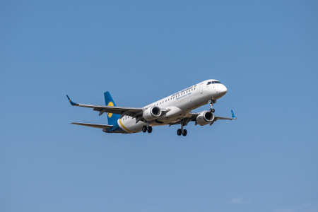 Boryspil, Ukraine - September 25, 2020: Ukraine International Airlines Embraer ERJ-195 is landing in the airportのeditorial素材