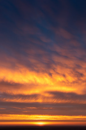 Dramatic apocalyptic sky  background on sunrise in summerの写真素材