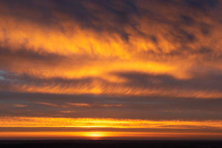 Dramatic apocalyptic sky  background on sunriseの写真素材