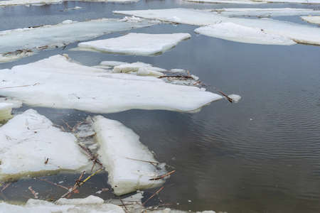Melted Ice drift in springtime on riverの写真素材