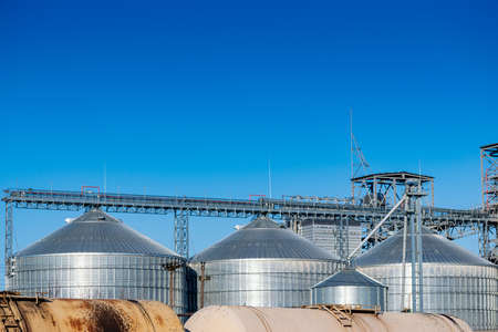 Railway cars near the elevator silos closeup viewの写真素材